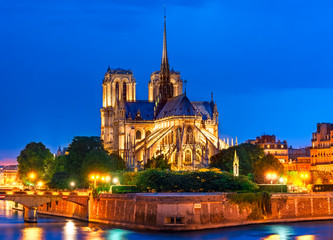 Ile de la Cite, Paris, France: Night view of Cathedrale Notre Dame de Paris or Our Lady of Paris, a beautiful cathedral and an important example of French Gothic architecture, sculpture and stained