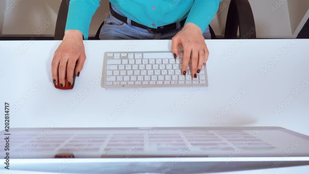 Aufkleber details top view unrecognizable woman sitting at the white desk in front of display typing on keyboa