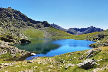 Naklejka na ściany i meble Tristaina high mountain lakes in Pyrenees. Andorra.