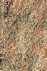 Natural stone granite texture, granite pattern. Stone background of mottled granite igneous rock used for kitchen worktops etc. Surface of the marble with brown tint