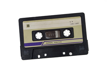 Old audio cassette isolated on white background.
