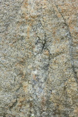 Natural stone granite texture, granite pattern. Stone background of mottled granite igneous rock used for kitchen worktops etc. Surface of the marble with brown tint