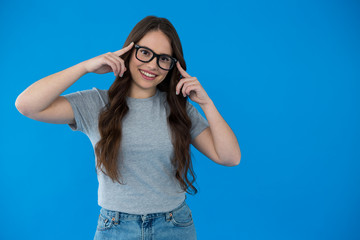 Happy woman in grey t-shirt and spectacles