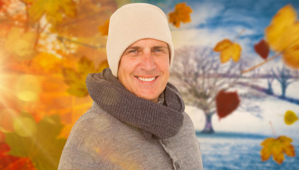 Casual man in warm clothing against autumn turning to winter
