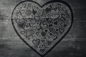 Obraz na płótnie Canvas Heart against overhead of wooden planks
