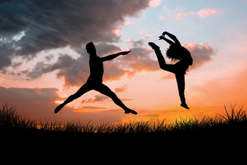 Male ballet dancer jumping against sun set © vectorfusionart