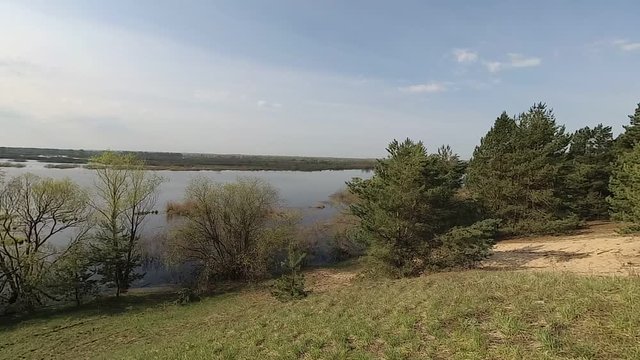 Belarus. Spring. Forest on a hill in the period of high water.