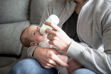 Young Father Caring for his First Baby Boy