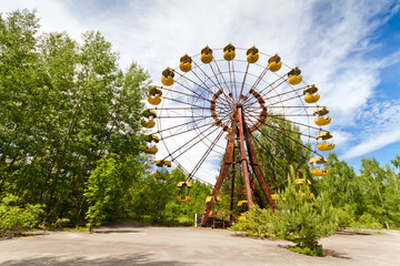 The abandoned Ferris wheel in the amusement park in a dead city Pripyat, Ukraine. Chernobyl nuclear...