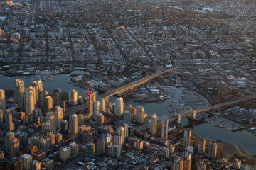 Aerial view of  False Creek and Downtown City during a vibrant sunset. Taken in Vancouver, British Columbia, Canada.