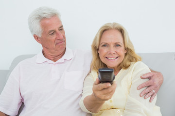 Senior couple watching television