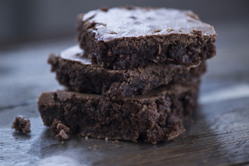 chocolate brownies on wooden background, close-up