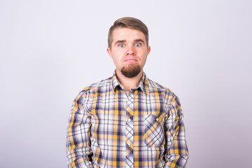 Obraz premium Portrait of a handsome young man against white background