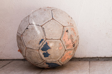 Old soccer ball, the ball is on the ground
