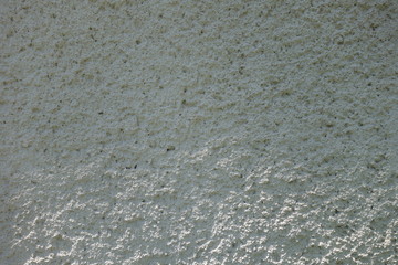 The image of the wall, plastered small stone for use as a background.