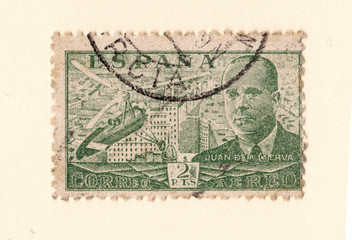 Fototapeta na wymiar an old green spanish postage stamp with an image of Juan de la Cierva inventor of the autogyro