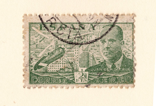 an old green spanish postage stamp with an image of Juan de la Cierva inventor of the autogyro