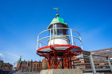 Fototapeta na wymiar Old beacon or small lighthouse in Hamburg Hafencity