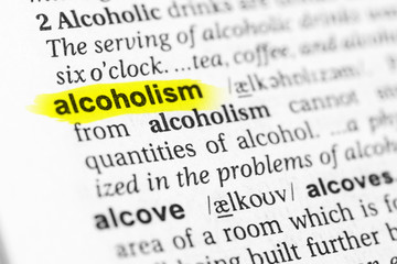 Highlighted English word "alcoholism" and its definition in the dictionary