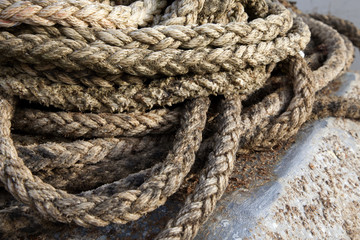 Fototapeta na wymiar Thick braided rope. Texture of a braided rope. Fishing net. 