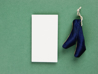 ballet slippers pointe gift and blank business card on the green background