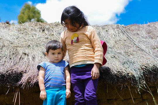 Little latin siblings in the countryside.