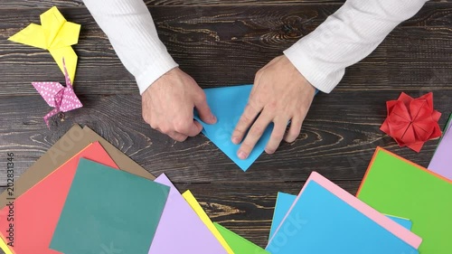 Male Hands Folding Blue Paper Man Making Origami Crane Top