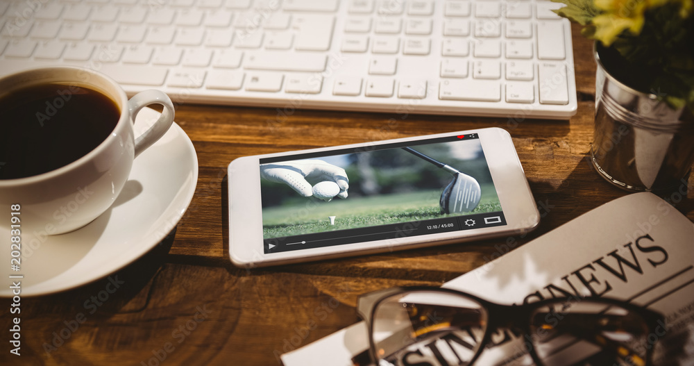 Poster view of lecture app against smartphone on table