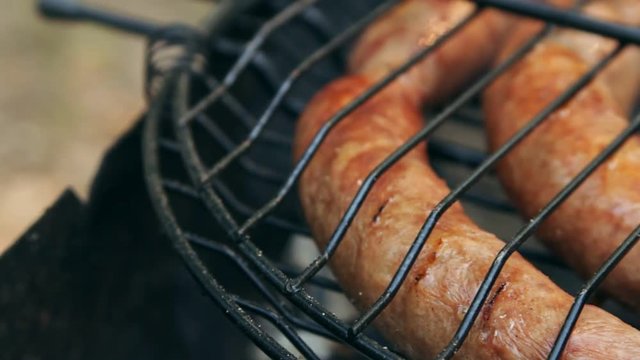 Grilled sausages on bbq. Variety Original Nuremberg Rostbratwurst . Pork ground meat, dill, nutmeg, garlic, cardamom, marjoram in the natural gut. There are also other types: rostbratwurst, currywurst