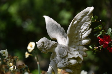 Sculpture of an angel who spreads his wings