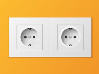White double power socket on orange wall