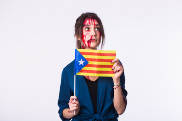 Portrait young catalan victim woman holding flag of catalonia isolated on white background. Protest against terrorism.