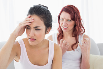 Obraz na płótnie Canvas Angry young female friends having an argument