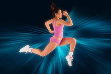 Fototapeta na wymiar Fit brunette running and jumping against abstract background