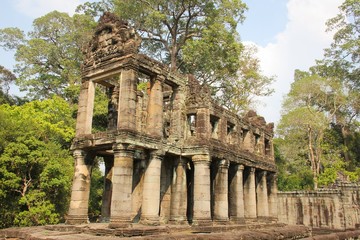 Fototapeta premium Ancient ruins structure in Angkor Wat Temples area in Siem Reap, Cambodia. Unesco World Heritage Site. Travel destination, tour guide, visit concept