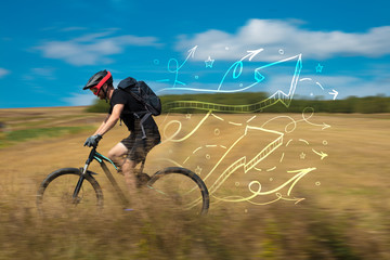 Fototapeta premium Young cyclist in casual clothing with fabulous nature background