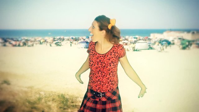 Fake scene, intentionally bad chroma-key: a wannabe little girl (actress in character) showing surprise and excitement while finding herself at the seashore.
