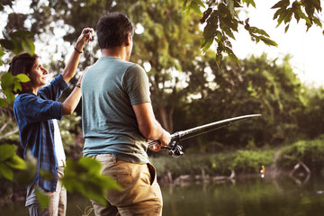 Couple fishing in the jungle