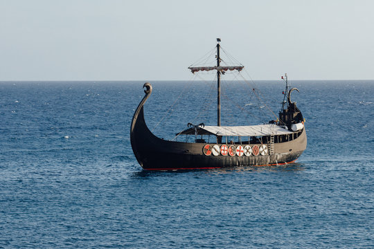 old black ship in the open sea