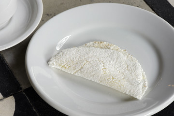 Beiju of tapioca on white plate