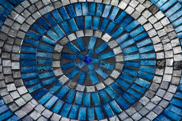 Blue mosaic tiles in circular pattern
