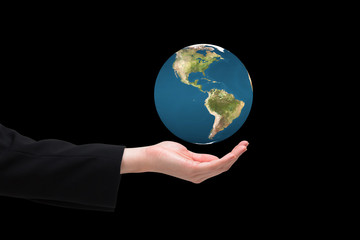 Businesswomans hand presenting against earth