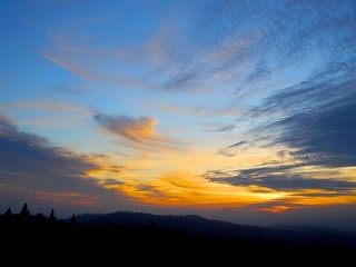 Colorful sunset sunrise sky hills silhouette