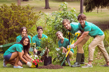 Happy friends gardening for the community