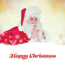 Santa keeping a secret and holding his sack against glowing christmas background