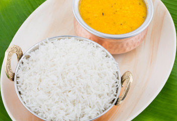 Indian Traditional Cuisine Dal Fry or Rice Also Know as Dal Chawal, Daal Chawal, Dal Rice, Whole Yellow Lentil with Rice or Dal Tadka, Daal Fry Served with Rice on Banana Leaf