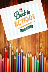 back to school against students desk with tablet pc