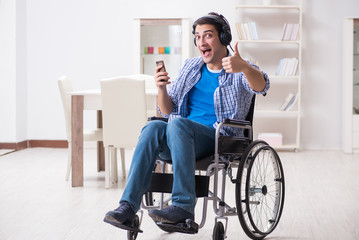 Disabled man listening to music in wheelchair