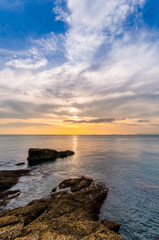 Landscape of beautiful seascape. Sea, rock and cloud in the sky at the sunset.