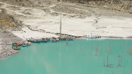 Beautiful turquoise Attabad Lake in hunza northern of Pakistan with boats